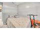 Cozy bedroom with patterned bedding and wall-mounted air conditioning unit at 2419 Wishing Well Way, Tampa, FL 33619