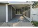 Enclosed carport featuring a screened area and an additional window at 2419 Wishing Well Way, Tampa, FL 33619