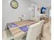 Bright dining area featuring a wooden table with seating for four at 2419 Wishing Well Way, Tampa, FL 33619