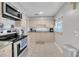 Well-lit kitchen with stainless steel appliances and light wood cabinets at 2419 Wishing Well Way, Tampa, FL 33619