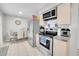 Functional kitchen with stainless steel appliances and an adjacent dining area at 2419 Wishing Well Way, Tampa, FL 33619