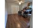 Bedroom with wood floors, ceiling fan, and a sliding glass door at 2635 Jarvis Cir, Palm Harbor, FL 34683
