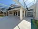 Outdoor covered patio featuring a sink and counter, and a ceiling fan for comfort at 2635 Jarvis Cir, Palm Harbor, FL 34683