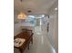 Eat-in kitchen with tiled floors and bright white finishes for a clean, modern aesthetic at 2635 Jarvis Cir, Palm Harbor, FL 34683