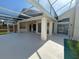 Spacious lanai features an outdoor kitchen and seamless access to the inviting pool at 2635 Jarvis Cir, Palm Harbor, FL 34683