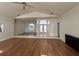 Inviting room with wood flooring, white walls, and ample natural light, perfect for Gathering enjoyment at 2635 Jarvis Cir, Palm Harbor, FL 34683