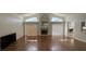 Bright living room with fireplace, vaulted ceilings, and wood floors, perfect for relaxing or entertaining at 2635 Jarvis Cir, Palm Harbor, FL 34683