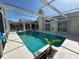 In-ground pool view featuring a clear blue pool surrounded by white concrete at 2635 Jarvis Cir, Palm Harbor, FL 34683