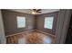 This room boasts a ceiling fan and bright natural light from the windows at 2910 15Th Ave S, St Petersburg, FL 33712