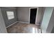 Cozy bedroom with tiled floors and neutral walls, filled with natural light at 2910 15Th Ave S, St Petersburg, FL 33712
