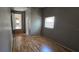 Inviting hallway leading to other rooms, with wood floors and modern lighting at 2910 15Th Ave S, St Petersburg, FL 33712