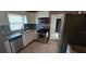 Updated kitchen featuring stainless steel appliances, modern cabinets, and stylish backsplash at 2910 15Th Ave S, St Petersburg, FL 33712