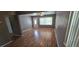 Bright living room featuring sleek wood floors, neutral gray walls, and an open layout at 2910 15Th Ave S, St Petersburg, FL 33712
