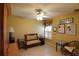 Comfortable bedroom with a ceiling fan and natural light at 29435 Snap Hook Dr, San Antonio, FL 33576