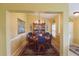 Charming dining room featuring a chandelier and a decorative china cabinet at 29435 Snap Hook Dr, San Antonio, FL 33576
