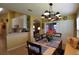 Open-concept dining room with a chandelier and a view of the kitchen at 29435 Snap Hook Dr, San Antonio, FL 33576