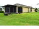 Attractive home exterior complemented by well-manicured lawn and a spacious screened-in patio at 29435 Snap Hook Dr, San Antonio, FL 33576