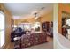 Inviting living room showcasing plantation shutters and an entertainment center at 29435 Snap Hook Dr, San Antonio, FL 33576