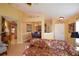 Comfortable living room with tiled floor, open to the dining area at 29435 Snap Hook Dr, San Antonio, FL 33576