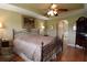 Spacious main bedroom with a tray ceiling and access to the bathroom at 29435 Snap Hook Dr, San Antonio, FL 33576