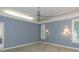 Bedroom with carpet, shutters, and blue walls at 3042 Oak Creek N Dr, Clearwater, FL 33761