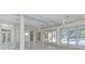 Bright, open living space featuring tile floors and glass doors overlooking the pool at 3042 Oak Creek N Dr, Clearwater, FL 33761