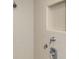 Close up of a shower with tiled walls and a built-in shower niche at 3042 Oak Creek N Dr, Clearwater, FL 33761