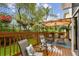 Comfortable back deck with covered area, seating, and a peaceful view of the surrounding greenery at 3484 Primrose Way, Palm Harbor, FL 34683