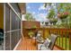 Inviting backyard deck featuring comfortable seating, decorative plants, and a serene outdoor space at 3484 Primrose Way, Palm Harbor, FL 34683