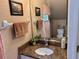 Cozy bathroom with granite countertop, modern fixtures, and a large mirror at 3484 Primrose Way, Palm Harbor, FL 34683
