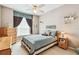 Tranquil bedroom with a comfy bed, natural light, and elegant window dressings at 3484 Primrose Way, Palm Harbor, FL 34683