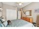 Serene bedroom with a comfortable bed, dresser, and convenient closet access at 3484 Primrose Way, Palm Harbor, FL 34683