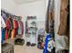 Walk-in closet featuring ample storage racks, shelving and clothing rods at 3484 Primrose Way, Palm Harbor, FL 34683