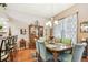 Bright dining area with traditional china cabinet and natural light at 3484 Primrose Way, Palm Harbor, FL 34683