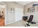 Functional exercise room with a weight bench, closet, and view to adjacent living spaces at 3484 Primrose Way, Palm Harbor, FL 34683