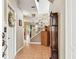 Open foyer with neutral colors, tile flooring, and stairway leading to upper level at 3484 Primrose Way, Palm Harbor, FL 34683