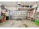 Spacious garage with overhead storage, cabinets and tools at 3484 Primrose Way, Palm Harbor, FL 34683