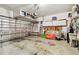 Spacious garage with ample storage, shelving, and a utilitarian sink, ready for projects at 3484 Primrose Way, Palm Harbor, FL 34683