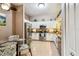 Bright eat-in kitchen offers stainless steel appliances and white cabinets at 3484 Primrose Way, Palm Harbor, FL 34683