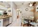 Kitchen nook offers a stainless dishwasher and access to the stairway in the home at 3484 Primrose Way, Palm Harbor, FL 34683