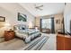 Spacious bedroom with vaulted ceiling, fan, and a large window with curtains at 3484 Primrose Way, Palm Harbor, FL 34683