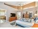 Spacious main bedroom features a ceiling fan, en-suite bathroom and walk-in closet access at 3484 Primrose Way, Palm Harbor, FL 34683