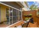 Screened patio with tile floor, bright interior and view to back deck at 3484 Primrose Way, Palm Harbor, FL 34683
