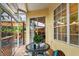 Screened patio with tile floor, bright interior and view to back deck at 3484 Primrose Way, Palm Harbor, FL 34683