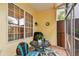 Enclosed lanai with tile floor, bright interior and view to back deck at 3484 Primrose Way, Palm Harbor, FL 34683