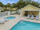 Community pool area offers lounging spots, a spa, and a bathhouse with ample seating at 3484 Primrose Way, Palm Harbor, FL 34683