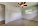 Cozy bedroom with a ceiling fan and a window letting in natural light at 38320 14Th Ave, Zephyrhills, FL 33542