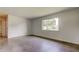 Cozy bedroom with a large window and neutral decor, offering a calming retreat at 38320 14Th Ave, Zephyrhills, FL 33542