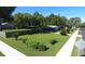 A beautifully landscaped yard surrounds a home with mature trees offering shade and curb appeal at 38320 14Th Ave, Zephyrhills, FL 33542