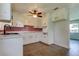 Cozy kitchen with updated cabinets, red backsplash, and modern appliances at 38320 14Th Ave, Zephyrhills, FL 33542